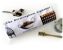 Load image into Gallery viewer, the birmingham alphabet tea towel featuring cadburys factory
