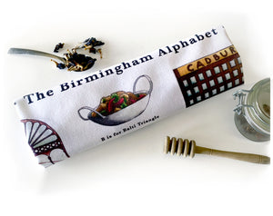 the birmingham alphabet tea towel featuring cadburys factory